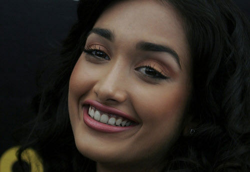 In this Dec. 19, 2008 file photo, Bollywood actress Jia Khan smiles during a promotional event of her forthcoming Hindi movie 'Ghajini' in Bangalore, India. Police said that Khan was found dead at her home in Mumbai late Monday, June 3, 2013. Khan began her career in Mumbai's film industry in the 2007 Hindi film 'Nishabd' in which she portrayed a teenager in love with her best friend's father, played by Bollywood superstar Amitabh Bachchan. AP Photo.
