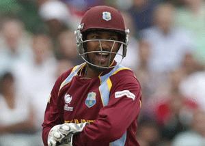 West Indies' wicket keeper Denesh Ramdin celebrates his wicket of Pakistan's Kamran Akmal during their ICC Champions Trophy group B cricket match at the Oval cricket ground in London, Friday, June 7, 2013.  AP photo