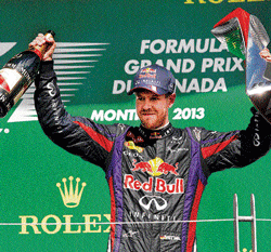 third time lucky Red Bull Sebastian Vettel celebrates his Canadian Grand Prix triumph on Sunday. ap