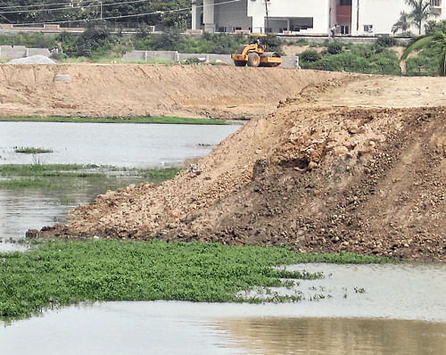 Desilting of the Devasandra lake for the past one month  has made matters worse for residents. dh photo