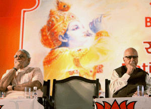 **FILE** Senior BJP leader L K Advani with Gujarat Chief Minister Narendra Modi at the National Council Meetinng in Surajkund in Sep 2012. Advani resigned from all party posts on Monday, a day after Modi was appointed as chairman of the party's election campaign committee. PTI Photo