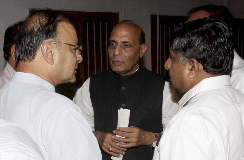 BJP President Rajnath Singh along with Senior leaders Arun Jaitley and Ravi Shanker after Party's parliamentary board meeting, at his residence in New Delhi on Monday. PTI Photo