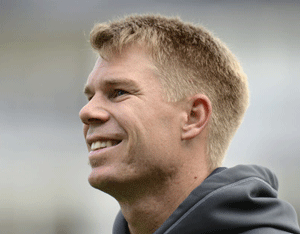 Australia's David Warner smiles before the ICC Champions Trophy group A match against New Zealand at Edgbaston Cricket Ground, Birmingham June 12, 2013. REUTERS