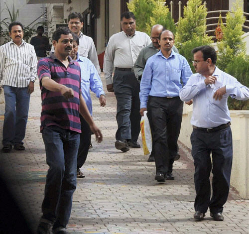 CBI officials leave after conducting raids at the residence of former coal minister Dasari Narayana Rao in Hyderabad on Tuesday. PTI Photo