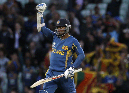 Sri Lanka's Kumar Sangakkara punches the air after he hit the winning runs to defeat England in their ICC Champions Trophy cricket match at the Oval cricket ground in London, Thursday, June 13, 2013. Kumar Sangakkara hit an unbeaten 134 not out in the match. AP photo