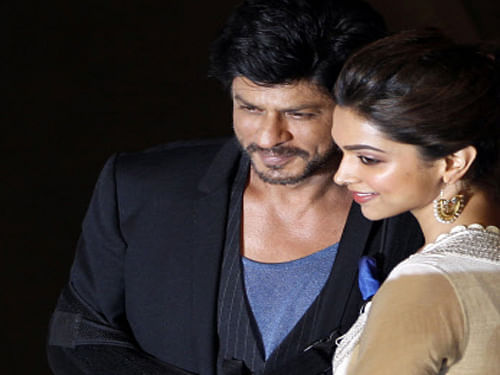 Shah Rukh Khan, left poses with co actor Deepika Padukone during the release of the trailer of his upcoming movie 'Chennai Express' in Mumbai, India, Thursday, June 13, 2013. Directed by Rohit Shetty, the film scheduled for release on August 8 features Khan and Padukone in lead roles. AP Photo
