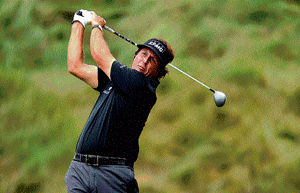 thwack! American Phil Mickelson hits the tee shot on the 18th hole during round one of the US Open on Thursday. AFP