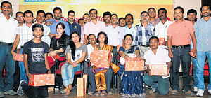 Winners of the Deccan Herald-Prajavani Cricket Mania contest pose during the prize distribution function in Bangalore on Saturday. DH PHOTO