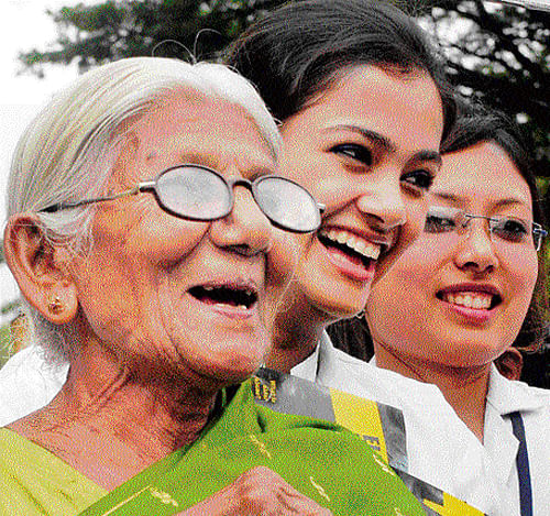 ageless An elderly woman shares a light moment with the participants at the awareness walk held to mark the World Elder Abuse and Awareness Day, in the City on Saturday. dh photo
