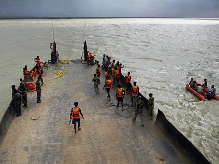 West Bengal Disaster Management rescue team at work after a boat capsized in river Ganga in Malda on Friday. There were over 40 people onboard the boat. PTI Photo.
