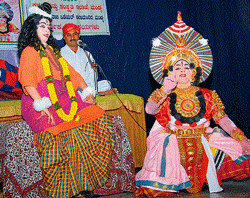 expressions: A P Pathak and troupe perform Yakshagana at Rotary West Hall, in Saraswathipuram, on Sunday. dh photo