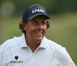 Phil Mickelson of the U.S. reacts after his birdie on the 17th green during the third round of the 2013 U.S. Open golf championship at the Merion Golf Club in Ardmore, Pennsylvania, June 15, 2013. REUTERS
