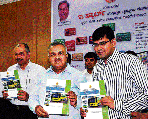 Transport Minister Ramalinga Reddy launches e- Smart project, at  KSRTC Central Office in Bangalore on Monday. Transport Department Principal Secretary P Ravikumar and NWKRTC MD Manoj Jain (right) are with him. DH PHOTO