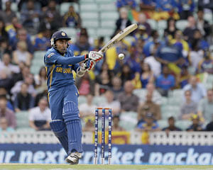 Sri Lanka's Mahela Jayawardena hits four runs off the bowling of Australia's Mitchell Johnson during their ICC Champions Trophy cricket match at the Oval cricket ground in London, Monday, June 17, 2013. AP Photo