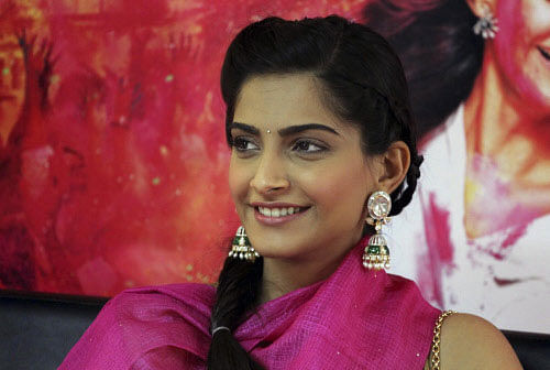 Bollywood actor Sonam Kapoor smiles during a press conference to promote her new movie "Raanjhnaa" in Ahmadabad, India, Monday, June 17, 2013. The film will be released in India on June 21. AP Photo
