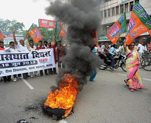 BJP workers demonstrate during their day-long shutdown called to protest against the alleged 'betrayal' by the JD-U in Patna, Bihar on Tuesday. PTI Photo