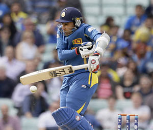 Sri Lanka's Mahela Jayawardena gets hit by a short delivery from Australia's Clint McKay during their ICC Champions Trophy cricket match at the Oval cricket ground in London, Monday, June 17, 2013. AP Photo