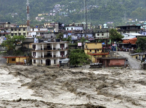 Houses are partly submerged in the flooded River Ganges in Uttarakashi district, in the northern Indian state of Uttarakhand, India, Tuesday, June 18, 2013. Monsoon torrential rains have cause havoc in northern India leading to flash floods, cloudbursts and landslides as the death toll continues to climb and more than 1,000 pilgrims bound for Himalayan shrines remain stranded. (AP Photo)