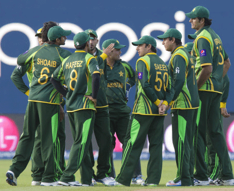 Pakistan players gather on the pitch as they loose by 8 wickets against India during their ICC Champions Trophy cricket match at Edgbaston cricket ground, Birmingham, England, Saturday June 15, 2013. AP Photo.