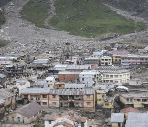 The Kedarnath Temple (C, back) is pictured amid damaged surroundings by flood waters at Rudraprayag in the Himalayan state of Uttarakhand June 18, 2013. Early monsoon rains have swollen the Ganges, India's longest river, swept away houses, killed at least 60 people and left tens of thousands stranded, officials said on Tuesday. REUTERS/