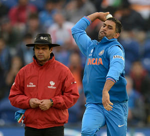 Skipper MS Dhoni bowls during India's semifinal match against Sri Lanka on Thursday. Reuters