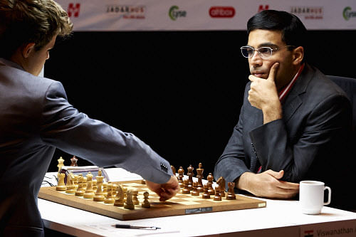 India's Viswanathan Anand, right, plays against Norway's Magnus Carlsen in the Norway Chess 2013 tournament in Sandnes near Stavanger, Norway, Thursday May 9, 2013. AP