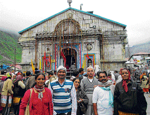 Lucky: Rukmini, from Kengeri in Bangalore, with her co-tourists in front of the Kedarnath temple on June 14, days before the disaster struck. dh photo