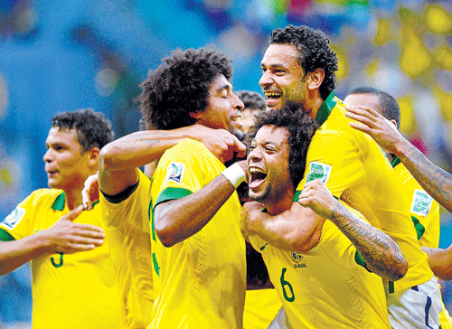 On song Brazilian players celebrate after Dante scored his team's first goal against Italy during their Confederations Cup match at the Fonte Nova Arena in Salvador on Saturday. AFP
