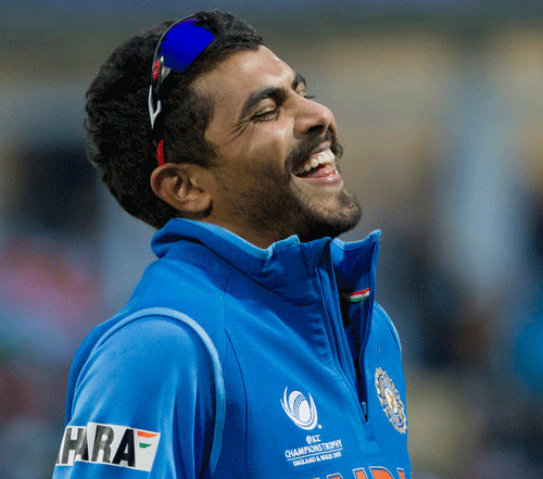 Ravindra Jadeja laughs after winning the golden ball and man of the match award after his side's win by 5 runs over England in the ICC Champions Trophy Final cricket match at Edgbaston cricket ground, Birmingham, England, Sunday June 23, 2013. (AP Photo