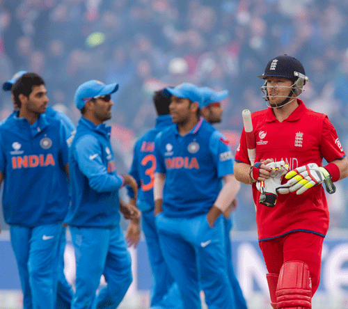 England's Ian Bell, centre right, walks from the pitch after being given controversially given run out off the bowling of India's Ravindra Jadeja during their ICC Champions Trophy Final cricket match at Edgbaston cricket ground, Birmingham, England, Sunday June 23, 2013. (AP Photo