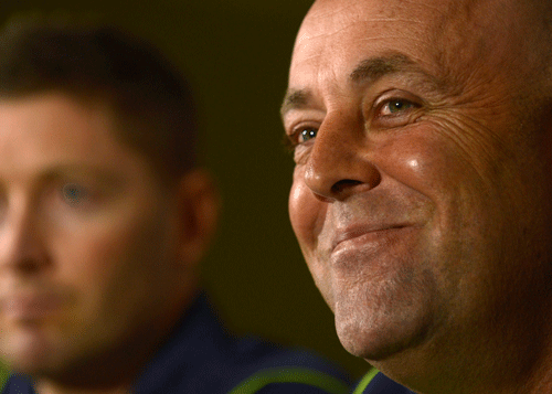 Australia's new cricket coach Darren Lehmann looks on during a news conference with captain Michael Clarke (L) at the Radisson Blu hotel in Bristol June 24, 2013. Australia have sacked their coach Mickey Arthur and replaced him with Lehmann just over two weeks before the start of the Ashes series against England. REUTERS.