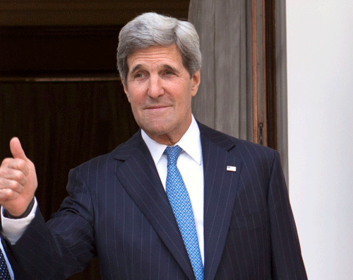U.S. Secretary of State John Kerry (R), on his first trip to India as secretary, gives the thumbs-up sign to the media as he joins Indian Foreign Minister Salman Khurshid (L)for a meeting at Hyderabad House in New Delhi, June 24, 2013. REUTERS.