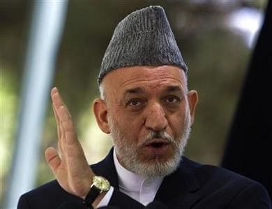 Afghanistan's President Hamid Karzai gestures as he speaks during a news conference in Kabul May 31, 2011. REUTERS