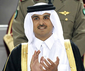 FILE - In this Saturday, Jan. 29, 2011, file photo, Qatar's crown prince, Sheik Tamim bin Hamad Al Thani, attends the AFC Asian Cup final soccer match between Japan and Australia in Doha, Qatar. Qatar's 61-year-old emir, Sheik Hamad bin Khalifa Al Thani, said Tuesday, June 25, 2013, he has transferred power to the 33-year-old crown prince in an anticipated move that puts a new generation in charge of the Gulf nation's vast energy wealth and rising political influence. AP Photo