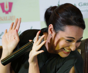 Actress Sonakshi Sinha gestures during a promotional event of her forthcoming movie 'Lootera' or Robber in Kolkata, India, Saturday, June 22, 2013. Lootera, a period romance drama is schedule to hit the theaters on July 5, 2013. AP photo