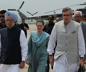 Prime Minister Manmohan Singh and United Progressive Alliance (UPA) chairperson Sonia Gandhi with Jammu and Kashmir Chief Minister Omar Abdullah arrive at Darab-Shala in Kishtwar district on Tuesday. PTI Photo
