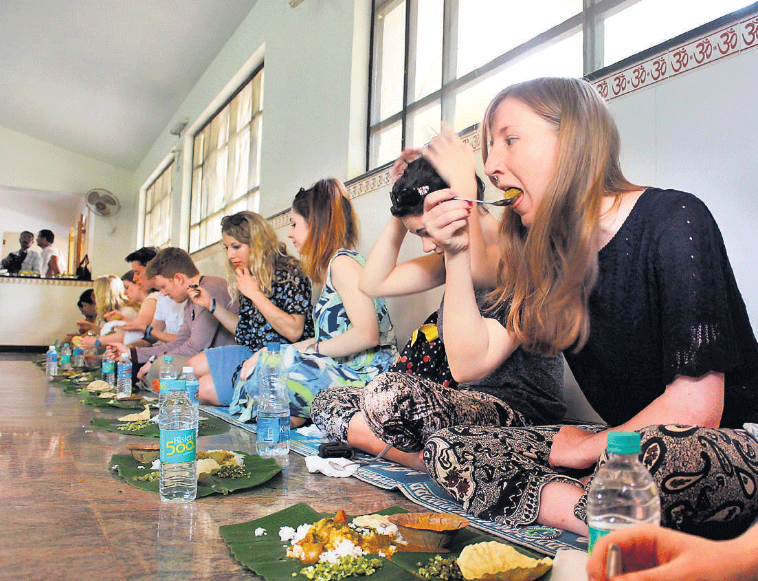 Experimenting: The foreign students sampling the local cuisine.