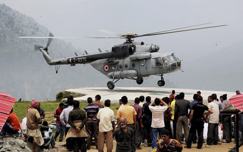 An IAF chopper during their relief operations in Gaurikund on Monday. PTI Photo