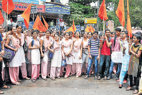 Students stage a protest in the leadership of ABVP by forming human chain in front of Jyothi Circle in Mangalore, on Tuesday.