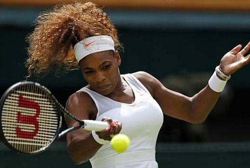 Serena Williams of the United States plays a return during her Women's first round singles match against Mandy Minella of Luxembourg at the All England Lawn Tennis Championships in Wimbledon, London, Tuesday, June 25, 2013. AP Photo.
