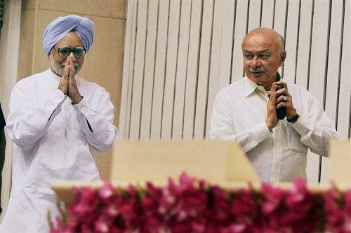 Prime Minister Manmohan Singh with Union Home Minister Sushilkumar Shinde. PTI photo