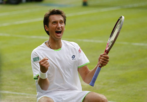 Sergiy Stakhovsky of Ukraine reacts as he wins against Roger Federer of Switzerland in their Men's second round singles match at the All England Lawn Tennis Championships in Wimbledon, London, Wednesday, June 26, 2013. AP Photo