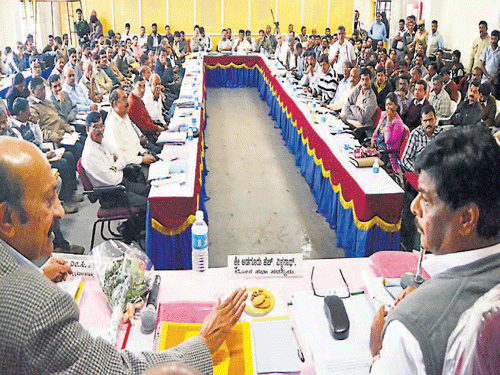 District-in-Charge Minister Dr H C Mahadevappa, MLC M C Nanaiah at a review meeting in Madikeri on Tuesday.
