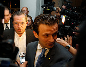 Ecuador's Foreign Minister Ricardo Patino (center L) talks to reporters before a function at a hotel in Singapore June 27, 2013. Patino said on Thursday an announcement would be made within half an hour in Ecuador about former CIA contractor Edward Snowden. REUTERS