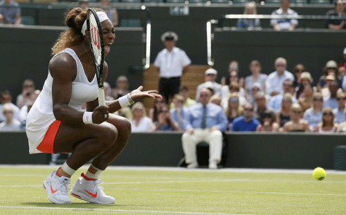Serena Williams of the U.S. reacts to hitting a shot into the net during her women's singles tennis match against Caroline Garcia of France at the Wimbledon Tennis Championships, in London Reuters
