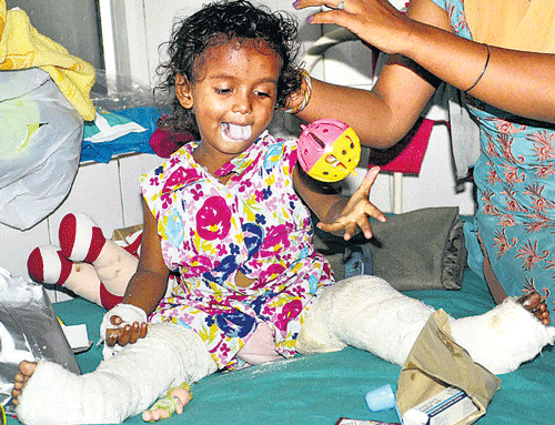 A two-and-a-half-year-old girl child injured in the floods in Kedarnath is admitted to hospital in Dehradun on Thursday. PTI