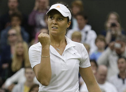 Laura Robson of Britain reacts after scoring a point against Mariana Duque-Marino of Colombia in their Women's second round singles match at the All England Lawn Tennis Championships in Wimbledon, London, Friday, June 28, 2013. (AP Photo