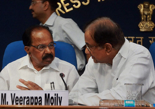 Union Finance Minister P Chidambaram and Minister for Petroleum & Natural Gas, M. Veerappa Moily during a press conference following a Cabinet Committee on Economic Affairs (CCEA) in New Delhi on Friday. PTI Photo