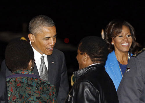 U.S. President Barack Obama and first lady Michelle Obama arrive at Waterkloof Air Base in South Africa Reuters Image
