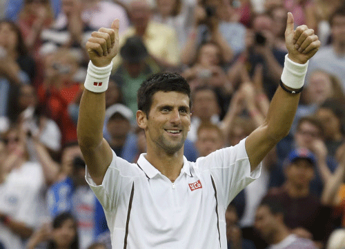 Novak Djokovic of Serbia celebrates after defeating Bobby Reynolds of the U.S. during their men's singles tennis match at the Wimbledon Tennis Championships, in London. Reuters